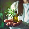 Image showing a cannabis plant and bottles of medical cannabis oil.